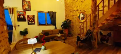 Coin salon dans l'établissement Maison avec hammam privé en option - Maison Mandala