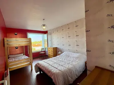 Un ou plusieurs lits dans un hébergement de l'établissement Appartement 2 chambres près plage, animaux admis - FR-1-323-309