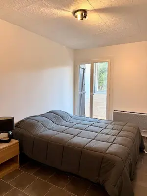 Un ou plusieurs lits dans un hébergement de l'établissement Appartement 2 pièces tout équipé à 100 m de la plage avec place de parking