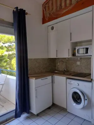 Cuisine ou kitchenette dans l'établissement Appart - résidence avec piscine St jean de Monts