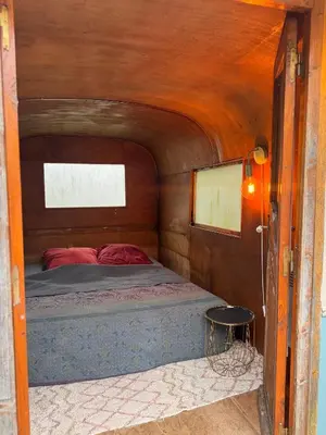 Un ou plusieurs lits dans un hébergement de l'établissement Tiny House dans la verdure et le calme