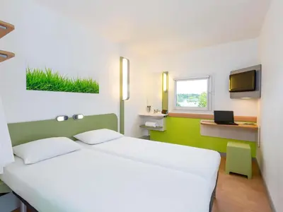 Un ou plusieurs lits dans un hébergement de l'établissement Ibis Budget Angers Parc des Expositions