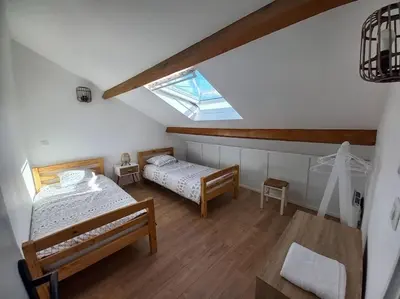 Un ou plusieurs lits dans un hébergement de l'établissement Chez Marina et Morgan Appartement 2 chambres