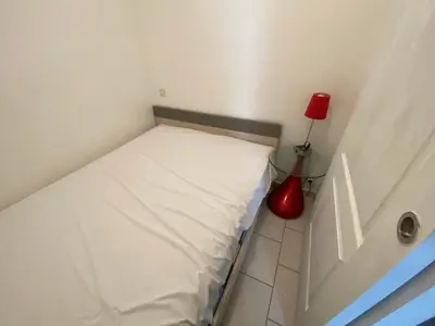 Un ou plusieurs lits dans un hébergement de l'établissement Studio en bord de mer, tous commerces animations