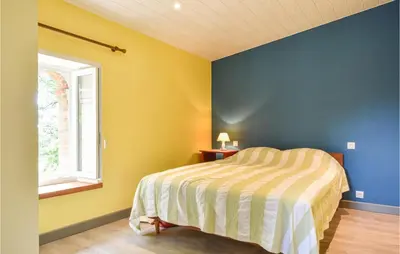 Un ou plusieurs lits dans un hébergement de l'établissement Nice Home In La Chapelle Hermier