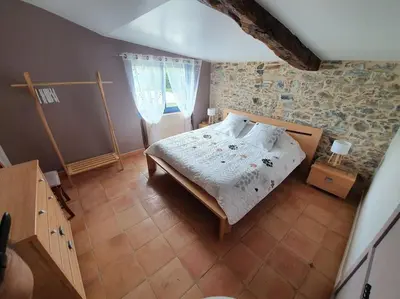 Un ou plusieurs lits dans un hébergement de l'établissement Gîte de la BOËRE - piscine