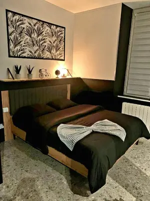 Un ou plusieurs lits dans un hébergement de l'établissement LOVE ROOM, La Douce Angevine