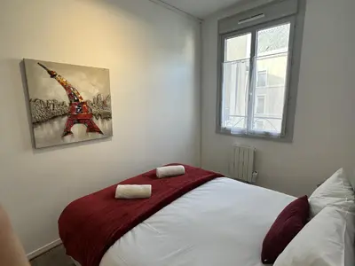 Un ou plusieurs lits dans un hébergement de l'établissement Charmant studio hyper centre