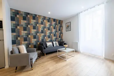 Coin salon dans l'établissement Très Bel Appartement Spacieux et Central
