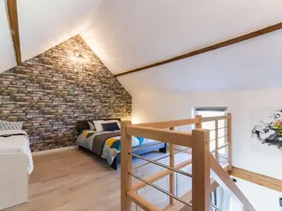 Un ou plusieurs lits dans un hébergement de l'établissement Le Cocoon Briéron