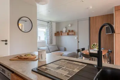 Coin salon dans l'établissement Mobil-home 40m - Piscine - Jardin
