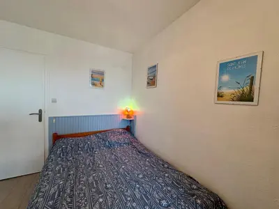 Un ou plusieurs lits dans un hébergement de l'établissement Appartement 4/6 pers. les pieds dans l'eau avec parking à St-Hilaire-de-Riez - FR-1-323-516