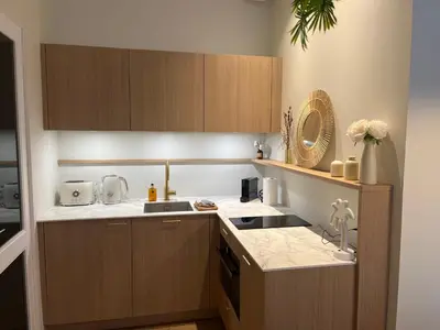 Cuisine ou kitchenette dans l'établissement Coeur de Ville