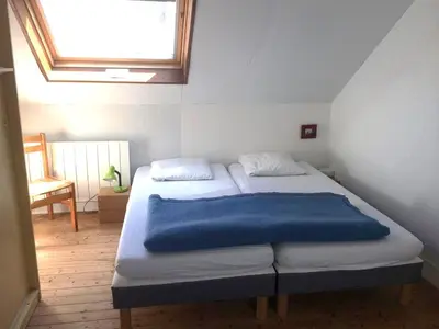 Un ou plusieurs lits dans un hébergement de l'établissement Maison Préfailles plein centre avec jardin