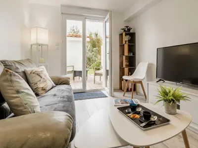 Coin salon dans l'établissement Charmant gîte indépendant avec terrasse, proche plage et golf, idéal pour des vacances à Pornic - FR-1-306-1267