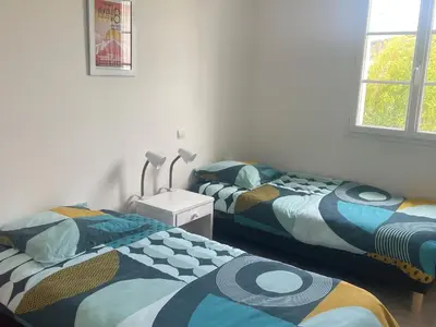 Un ou plusieurs lits dans un hébergement de l'établissement Maison 3 chambres, au calme, proche plage, fibre internet - FR-1-323-525