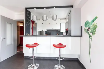 Cuisine ou kitchenette dans l'établissement Le Valentin - Appt proche des plages