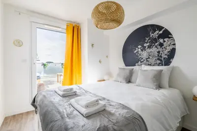Un ou plusieurs lits dans un hébergement de l'établissement Le Crépuscule - Appartement terrasse et parking