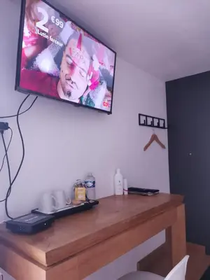 Télévision ou salle de divertissement dans l'établissement Cazama-Chambre indépendante