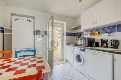 Cuisine ou kitchenette dans l'établissement La Joséphine - Maison avec terrasse