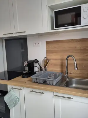 Cuisine ou kitchenette dans l'établissement Appartement lumineux et spacieux 70m2 proche de tout - 3 chambres