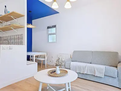 Coin salon dans l'établissement Appartement Le Porto