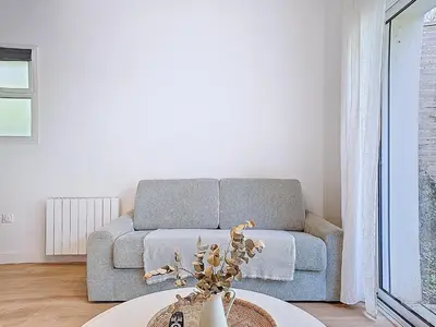 Coin salon dans l'établissement Appartement Le Porto