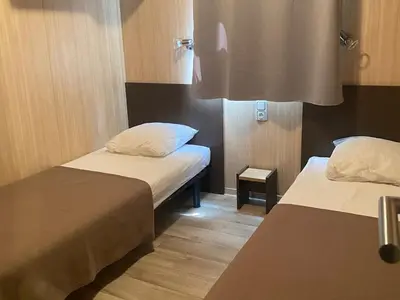 Un ou plusieurs lits dans un hébergement de l'établissement Chalet 2 chambres calme, piscine, proche lac Jaunay - FR-1-783-10