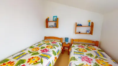 Un ou plusieurs lits dans un hébergement de l'établissement Le Jardin de la mer 150 plage