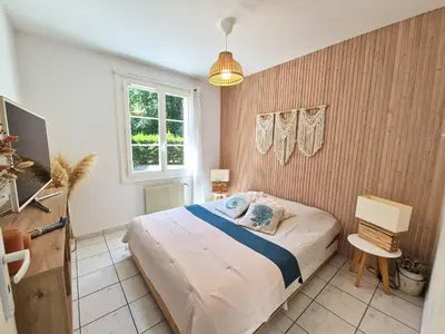 Un ou plusieurs lits dans un hébergement de l'établissement Appartement proche de l'aéroport de Nantes