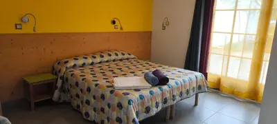 Un ou plusieurs lits dans un hébergement de l'établissement La Brise de Mer