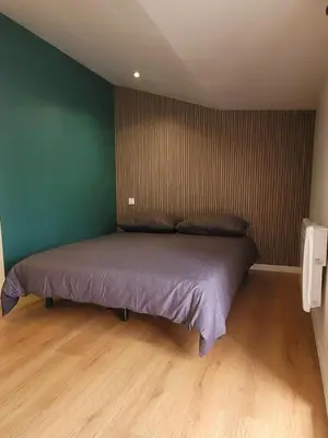 Un ou plusieurs lits dans un hébergement de l'établissement Maison Cosy Rénovée - Puy du Fou