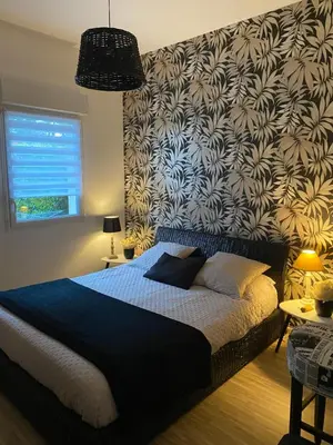 Un ou plusieurs lits dans un hébergement de l'établissement Pornichet 4 personnes a 3 mns de la plage avec jardin