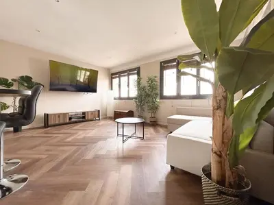 Télévision ou salle de divertissement dans l'établissement Le Jardin des Plantes