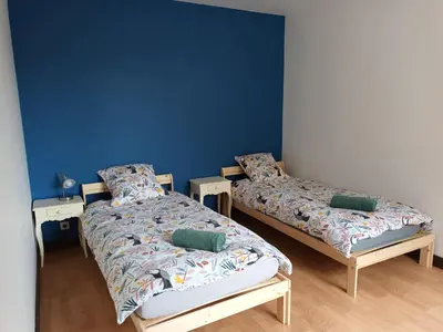 Un ou plusieurs lits dans un hébergement de l'établissement Gite la Blanchere