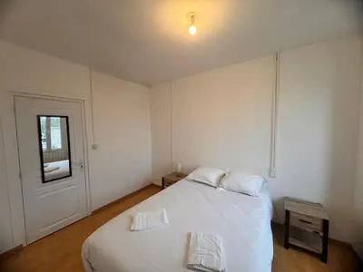 Un ou plusieurs lits dans un hébergement de l'établissement Maison 8 pers -Au bon endroit - 12 min du Parc
