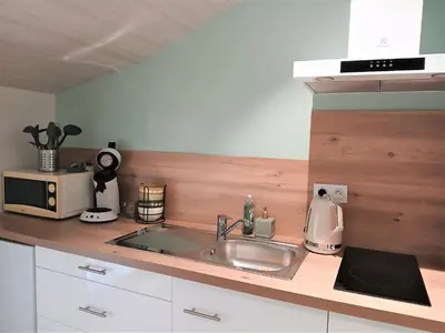 Cuisine ou kitchenette dans l'établissement Le P'tit Gîte d'Isa, 15 km du Puy du Fou