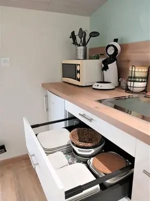 Cuisine ou kitchenette dans l'établissement Le P'tit Gîte d'Isa, 15 km du Puy du Fou