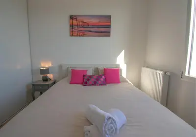 Un ou plusieurs lits dans un hébergement de l'établissement Appartement 90m2-Roof Top privé 100m2-Parking privé-Clim mobile