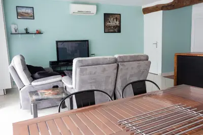 Télévision ou salle de divertissement dans l'établissement Duplex la galerie