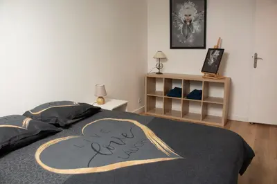 Un ou plusieurs lits dans un hébergement de l'établissement Duplex la galerie