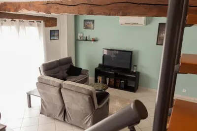 Télévision ou salle de divertissement dans l'établissement Duplex la galerie