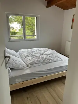 Un ou plusieurs lits dans un hébergement de l'établissement Maison proche de la mer