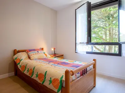 Un ou plusieurs lits dans un hébergement de l'établissement Apartment Le Bellevue by Interhome