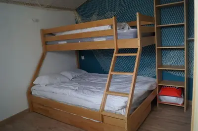 Un ou plusieurs lits dans un hébergement de l'établissement Maison de vacances saisonnier