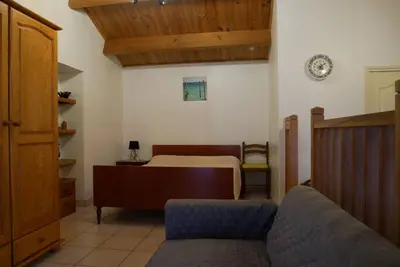 Un ou plusieurs lits dans un hébergement de l'établissement La Petite maison de pays