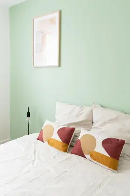 Un ou plusieurs lits dans un hébergement de l'établissement Le Noyer - appartement moderne & accessible