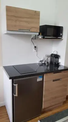 Cuisine ou kitchenette dans l'établissement Petit studio Magellan