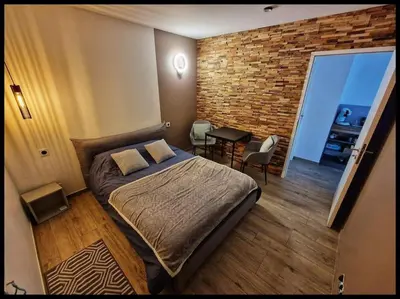 Un ou plusieurs lits dans un hébergement de l'établissement Studio 2 chambres chez particulier, avec entrée indépendante, proche du Puy Fou, encas du matin offert