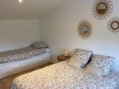 Un ou plusieurs lits dans un hébergement de l'établissement Maison Jasmin proche de l'océan